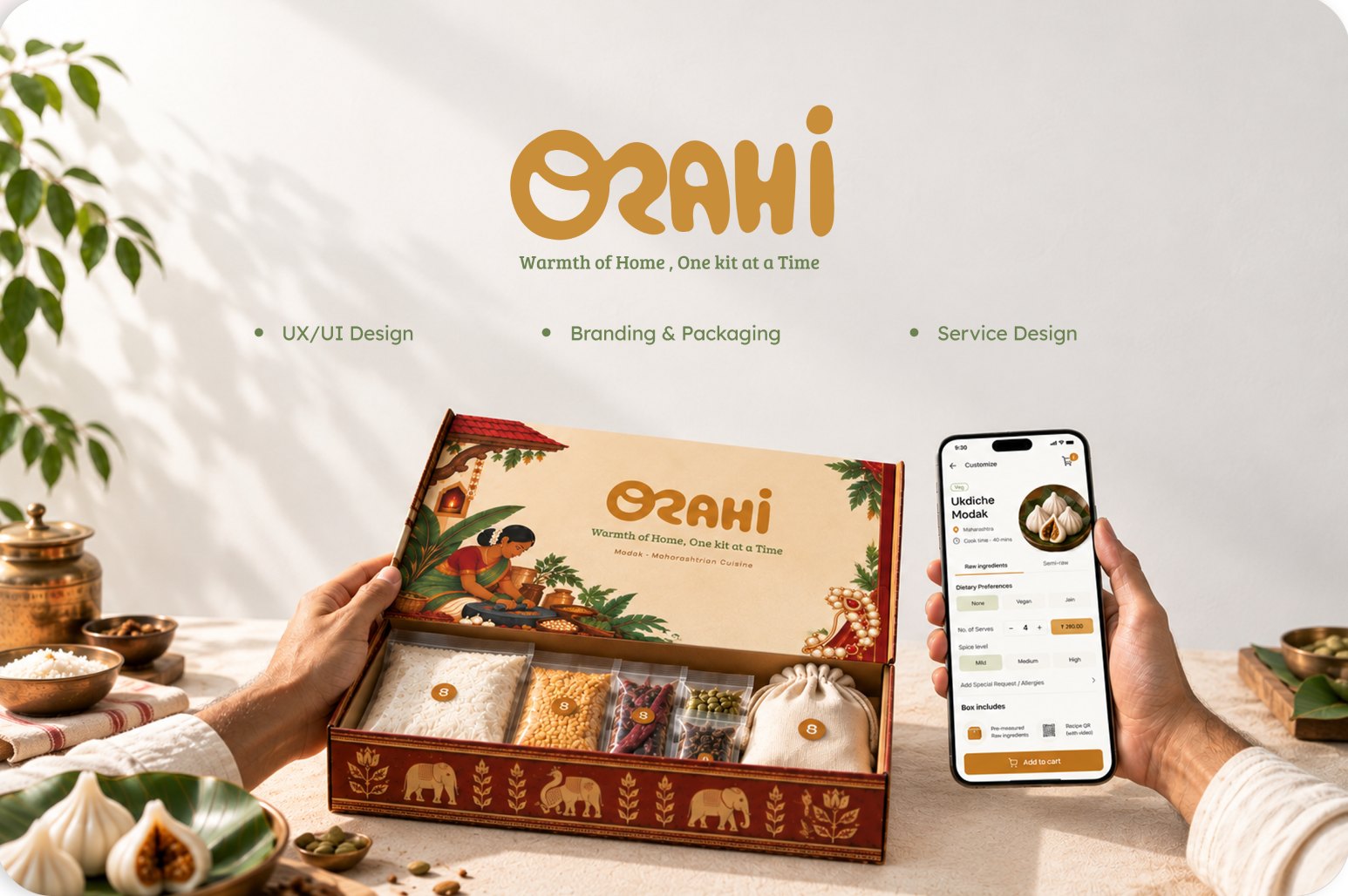 Ozahi meal-kit box with Modak ingredients beside the Ozahi app on a phone